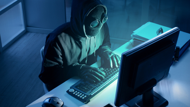Hacker stealing data from computer